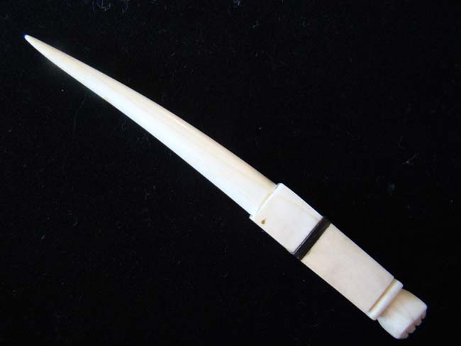 A 19th century Whale Ivory Bodkin with clenched fist knob